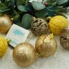 Set de 12 ornamente de brad, de tip glob, auriu/galben, din plastic, cu finisaj sclipitor